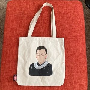 The Strand Icon RBG Time is one the side of CHANGE Tote Bag
